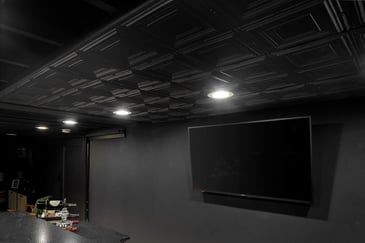 Black Drop Ceiling Tiles Fitted In A Basement