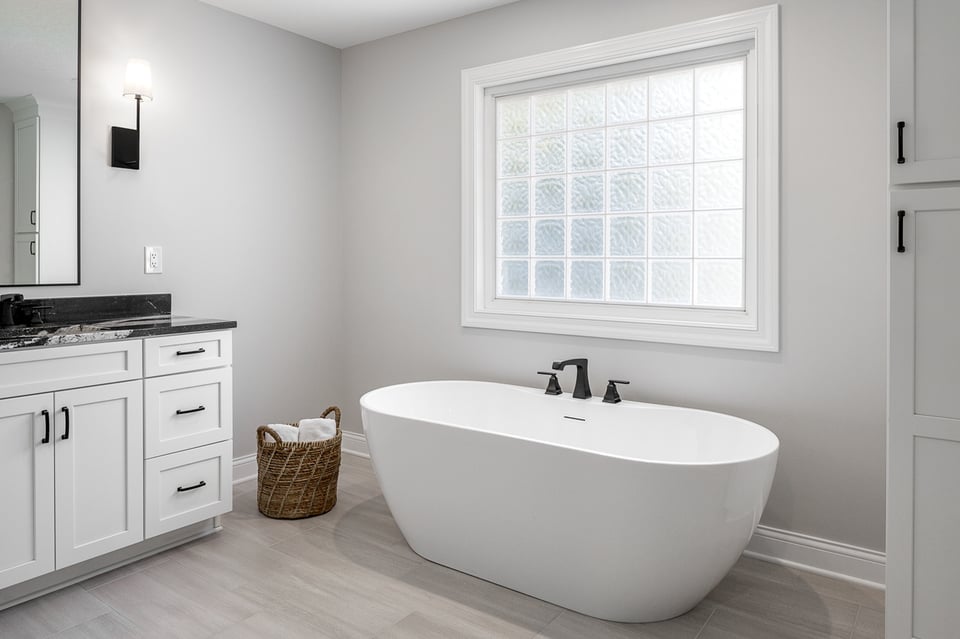 a tub-focused master bathroom with faucets on the bathtub