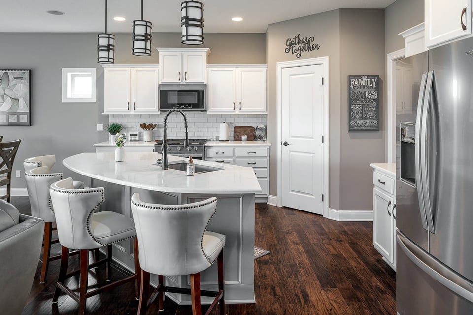 Full After Kitchen Remodel with Circle Counter Top and wooden floors