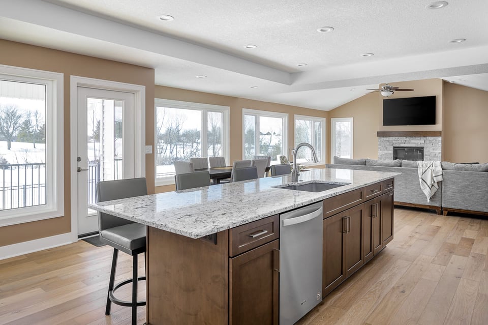 Full Kitchen Remodel with Large Windows And Vinyl Flooring