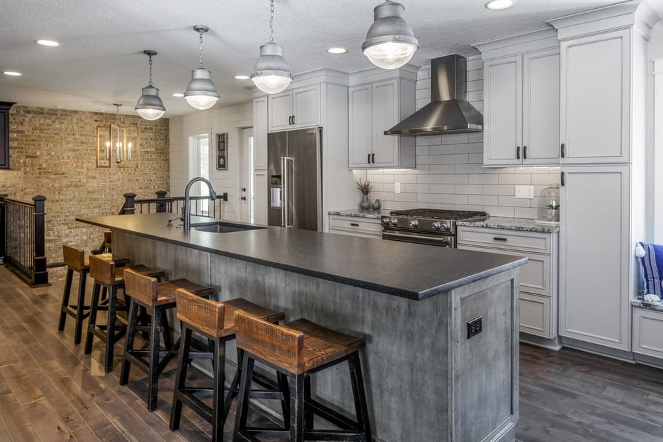 Kitchen Remodel with Large Eat-In Island and Subway Tile and Stone Accent Wall | Compelling Homes