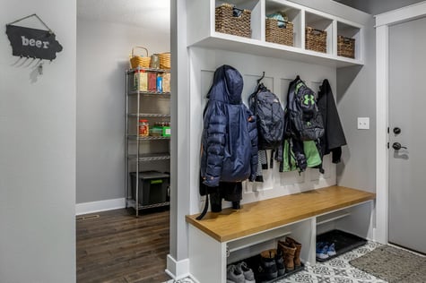 Whole Home Remodel Custom Mudroom and Pantry Area Behind Sliding Barn Door Custom Built-Ins | Compelling Homes