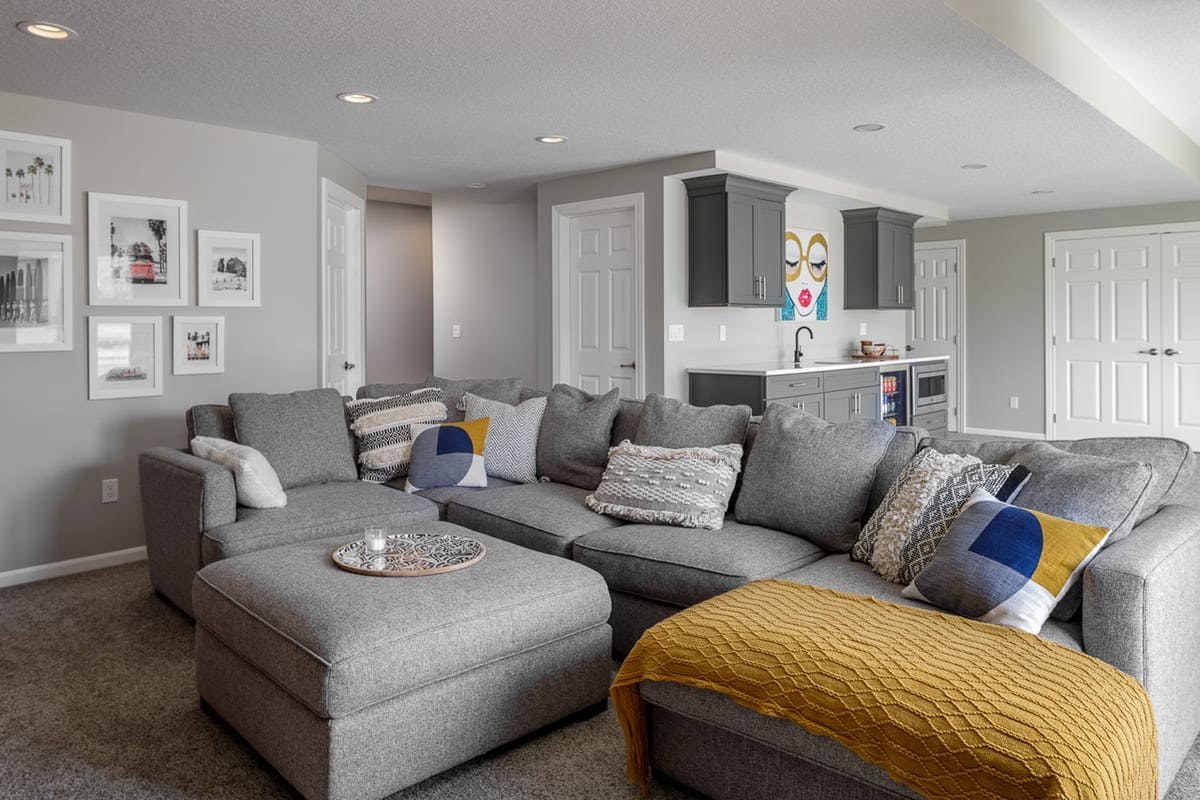 Basement Remodel Custom Cabinetry Walk-Up Bar and Basement Bathroom with Gallery Wall | Compelling Homes Remodeling & Design