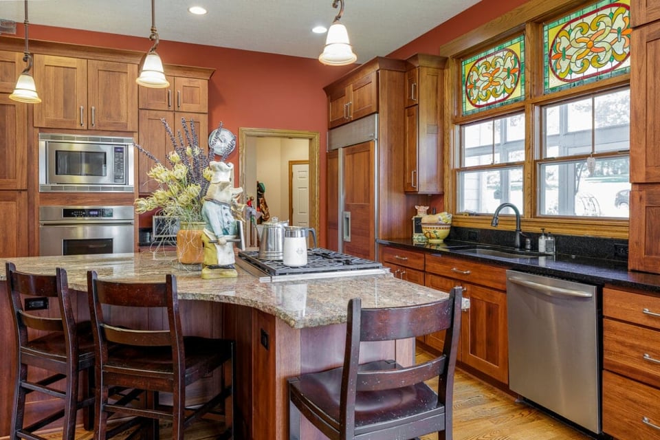 High counter tops, wooden dining seats and wooden floors