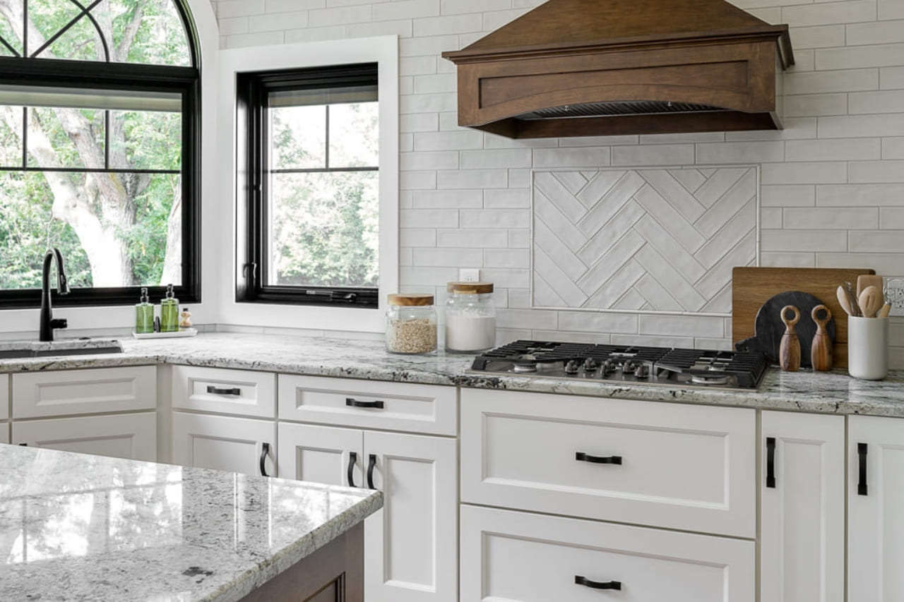 Modern White Kitchen with Large Black Paned Windows with White Cabinets and Modern Black Hardware | Compelling Homes Design Build