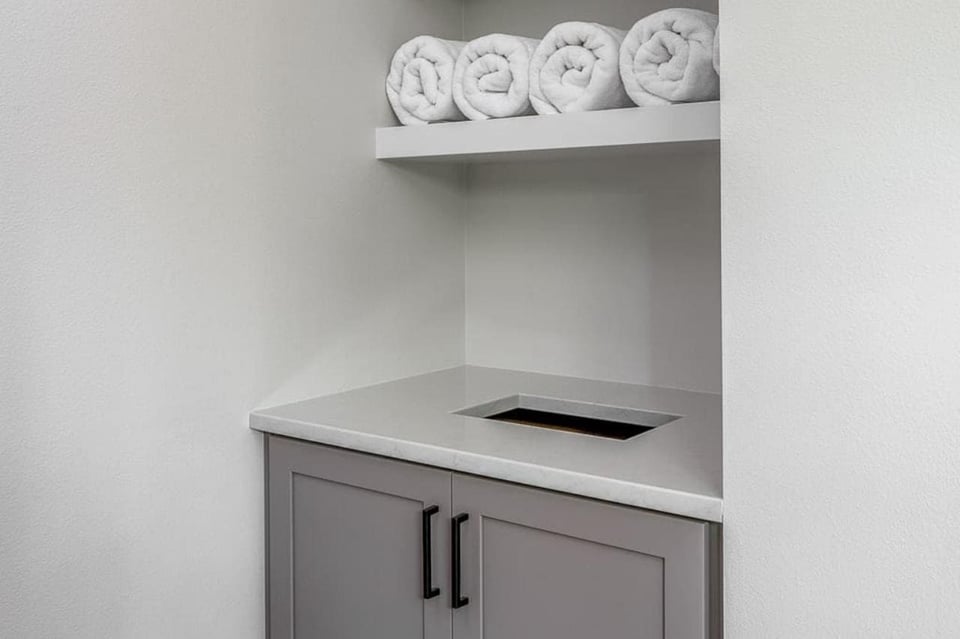 Bathroom Storage Area with Floating Shelves for Towels | Compelling Homes