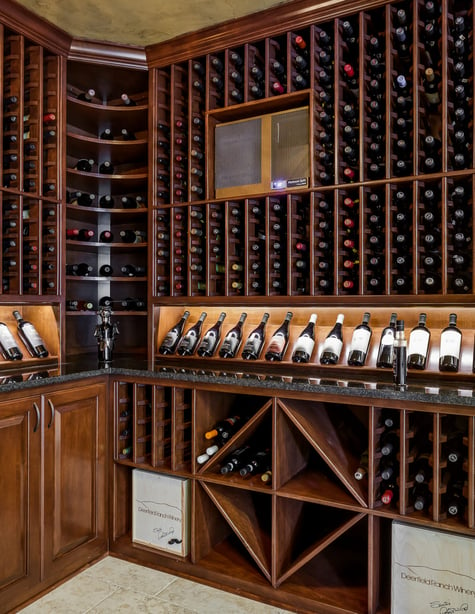 In-Home Wine Cellar with Custom Shelving in Walk Out Basement Remodel | Compelling Homes Des Moines, IA