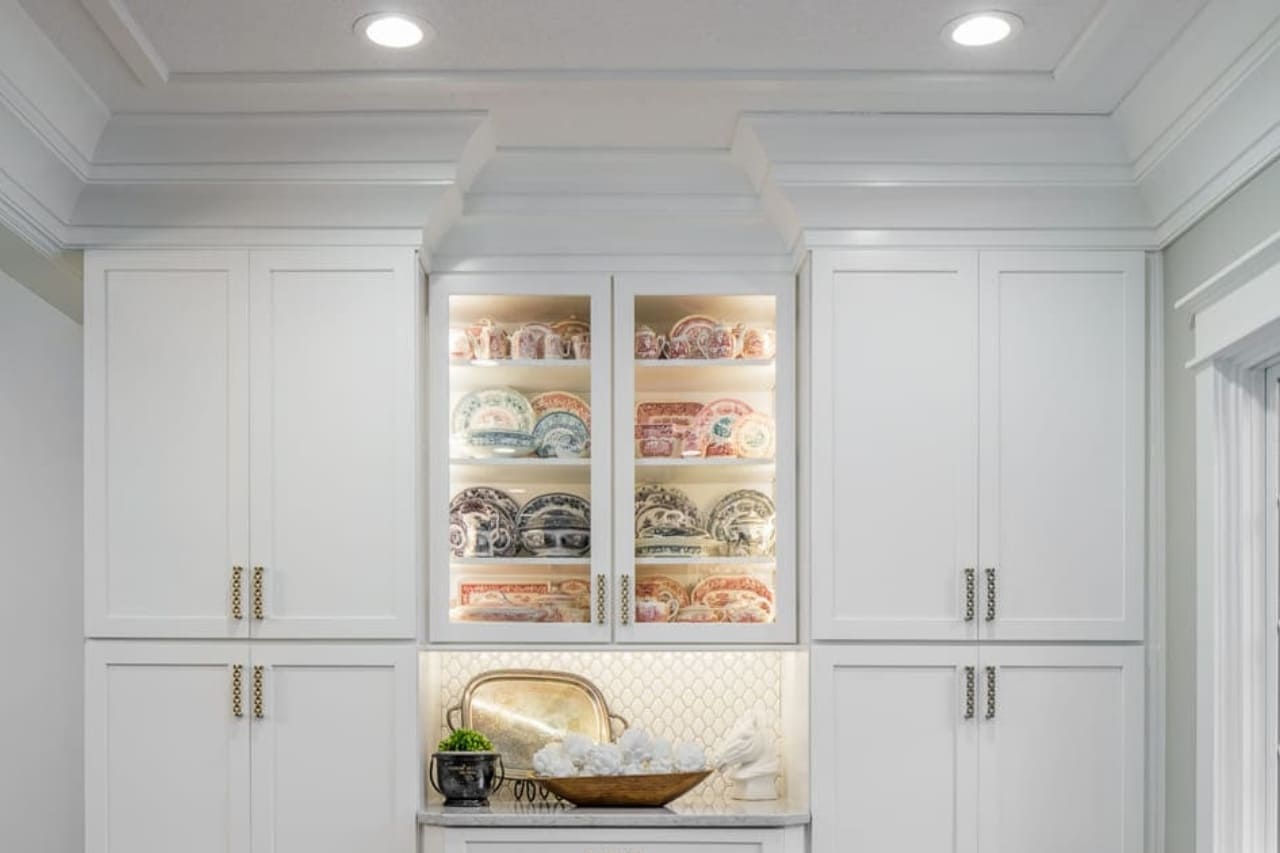 Handcrafted Custom Crown Molding Details in Sitting Room Off of Kitchen Remodel with Custom Built In Cabinetry | Compelling Homes Design-Build Experts in Des Moines, IA