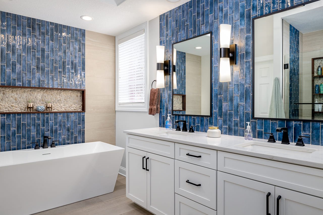 Blue Bathroom featuring Vertical Blue Backsplash Accent Walls and Freestanding Tub