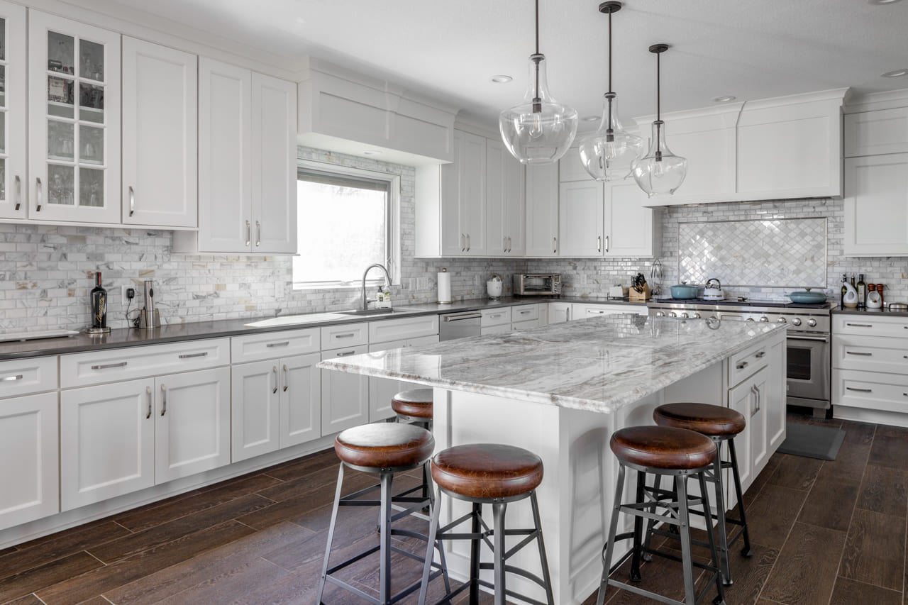 Gorgeous and Bright Kitchen with Eat-in Island and Mosaic Tile Backsplash