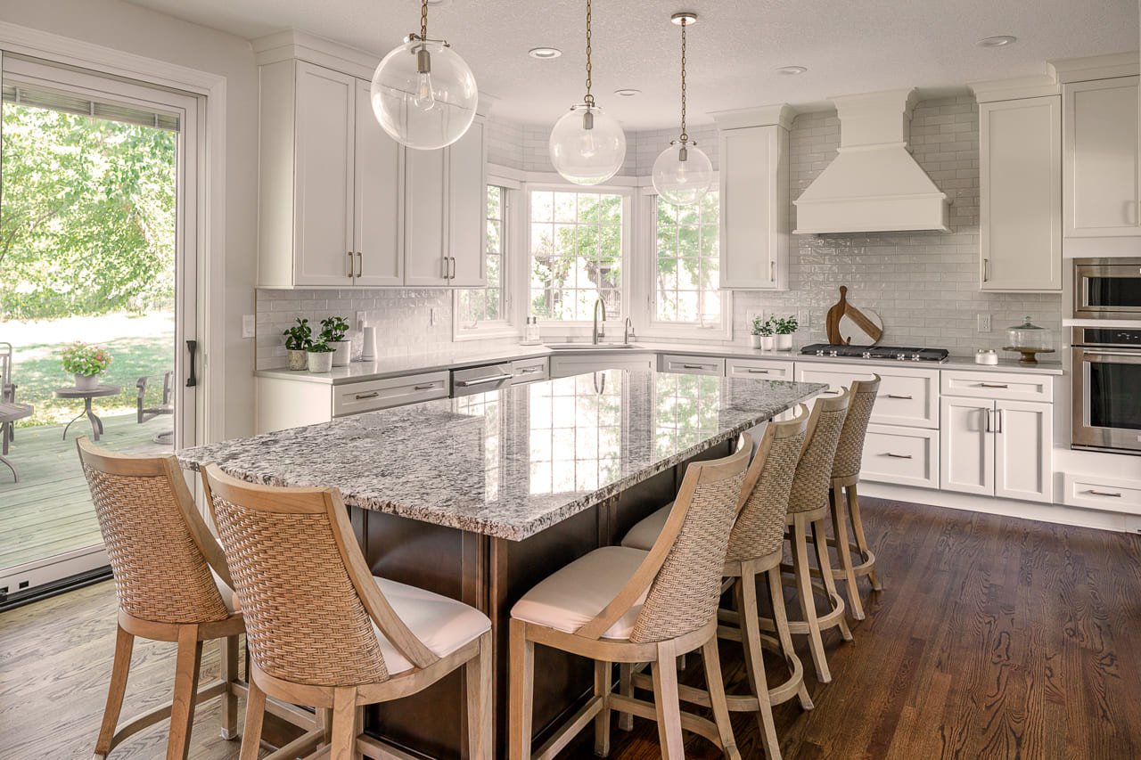 Full Kitchen View with Large Countertop and White Accents | Compelling Homes